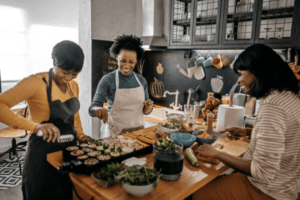 women making food in a kitchen holiday ready